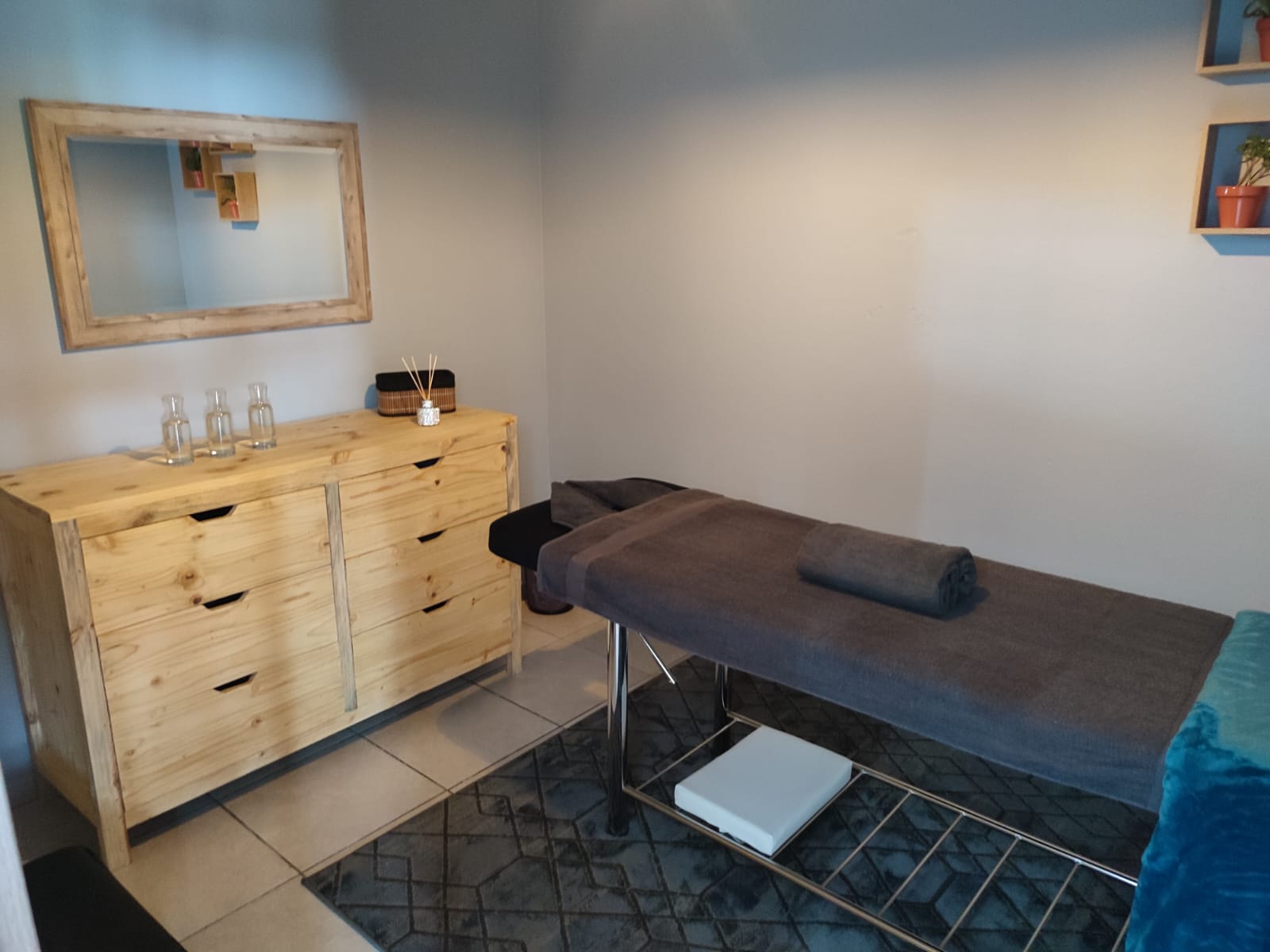 Treatment room with oils and wooden cabinet